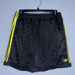 Adidas Skateboarding Men's Black Shorts with Yellow Stripes